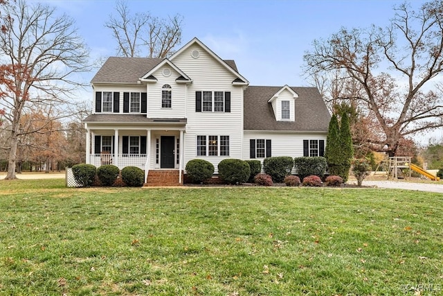 view of front of house with a porch and a front yard