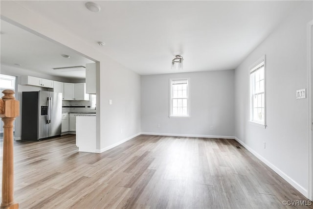 unfurnished living room with light hardwood / wood-style flooring