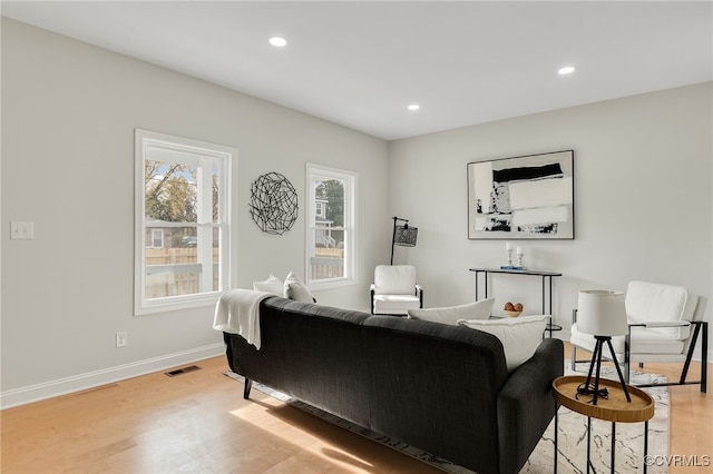 living room with light hardwood / wood-style floors