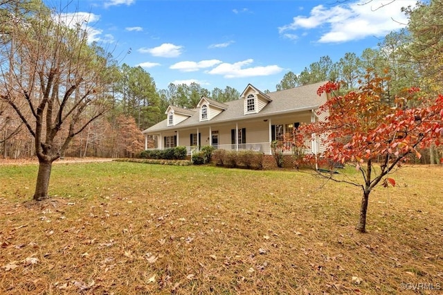 cape cod house with a porch and a front lawn