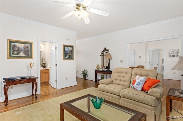 living room with ceiling fan, wood-type flooring, and ornamental molding