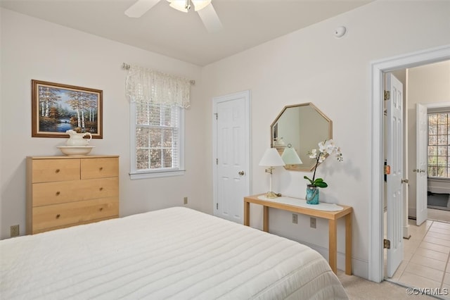 tiled bedroom with ceiling fan