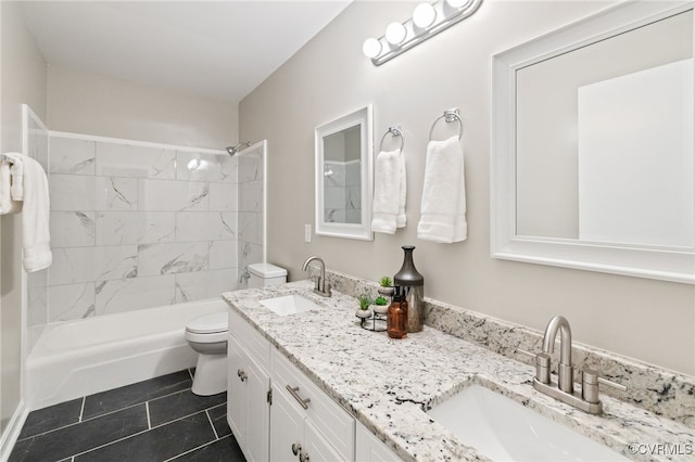 bathroom featuring tile patterned flooring, vanity, and toilet