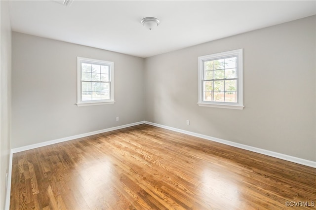 empty room featuring wood-type flooring