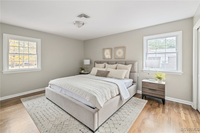 bedroom with hardwood / wood-style floors