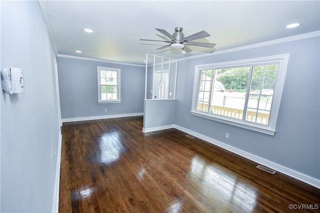 empty room featuring dark hardwood / wood-style flooring, ceiling fan, and crown molding