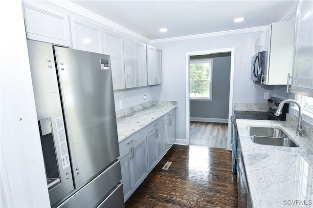 kitchen with dark hardwood / wood-style flooring, light stone counters, crown molding, sink, and stainless steel fridge with ice dispenser