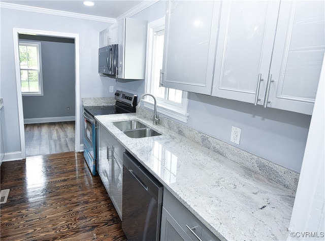 kitchen featuring white cabinets, sink, stainless steel appliances, and dark wood-type flooring