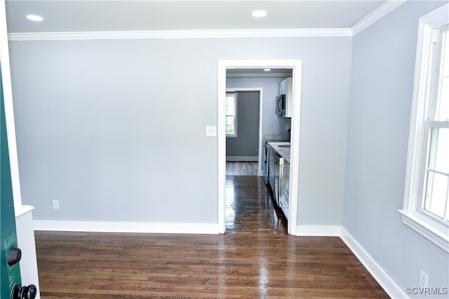 unfurnished room featuring crown molding and dark hardwood / wood-style floors