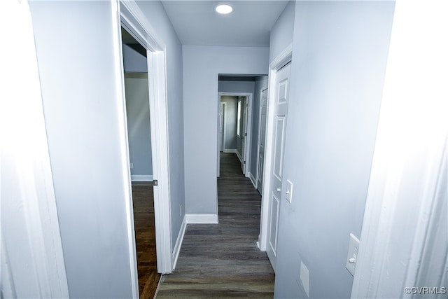 hall with dark hardwood / wood-style floors