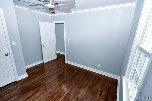 unfurnished bedroom featuring ceiling fan, dark hardwood / wood-style flooring, and ornamental molding