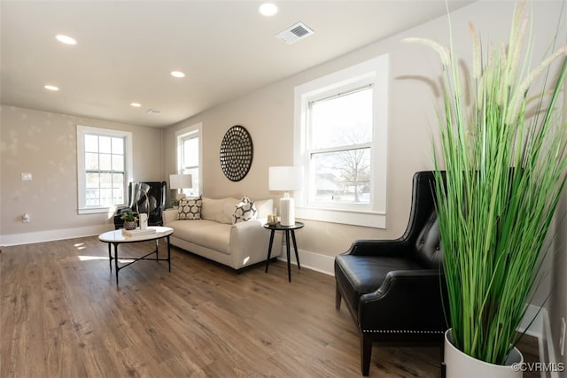 sitting room with dark hardwood / wood-style flooring