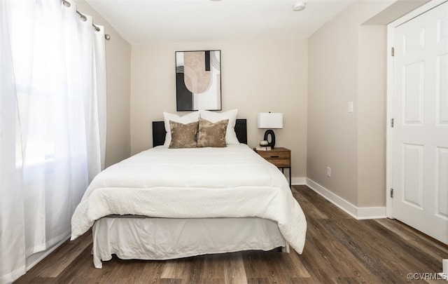 bedroom featuring dark hardwood / wood-style floors