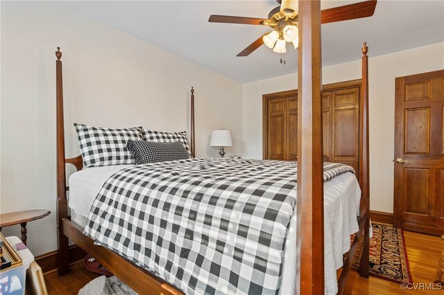 bedroom featuring wood-type flooring and ceiling fan