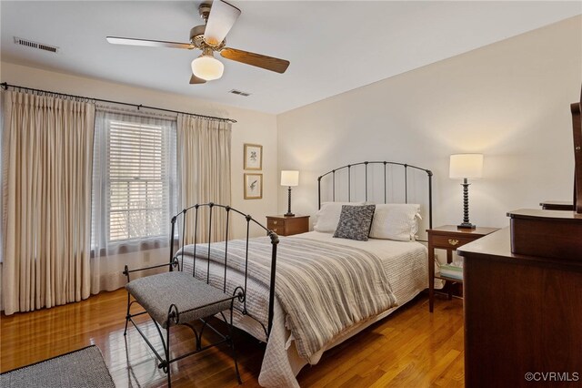 bedroom featuring hardwood / wood-style flooring and ceiling fan