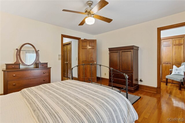 bedroom featuring ceiling fan and light wood-type flooring