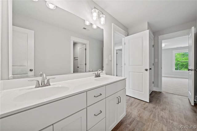 bathroom featuring hardwood / wood-style floors and vanity