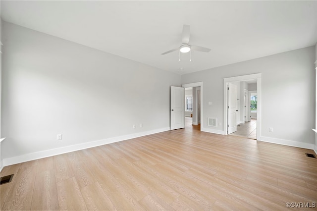 unfurnished room featuring ceiling fan and light wood-type flooring