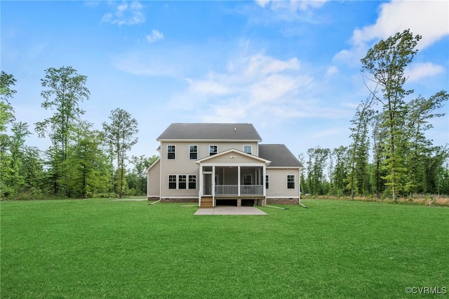 back of house with a sunroom, a patio area, and a lawn