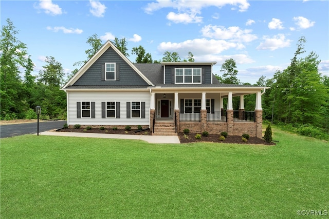 craftsman-style home with a front yard and a porch