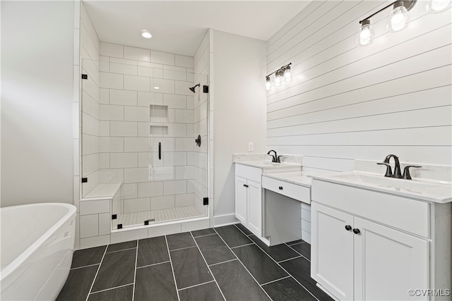 bathroom with tile patterned flooring, vanity, and independent shower and bath