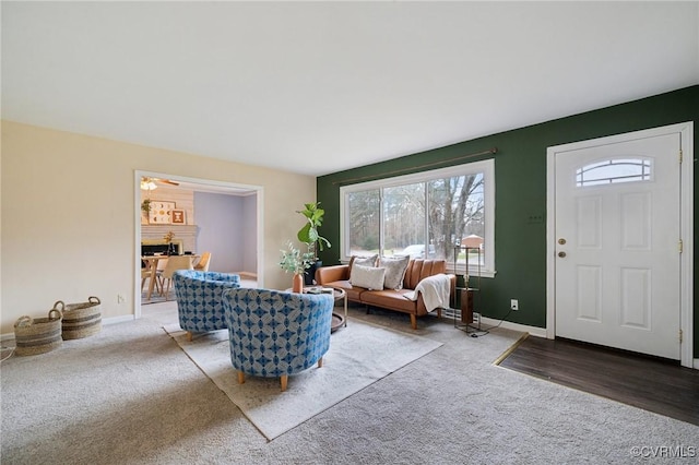 living room featuring hardwood / wood-style floors and ceiling fan