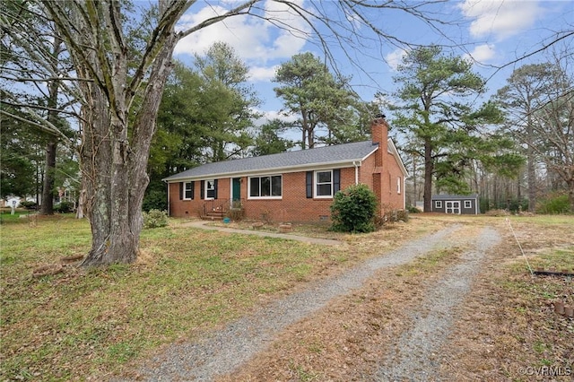 single story home featuring a storage unit