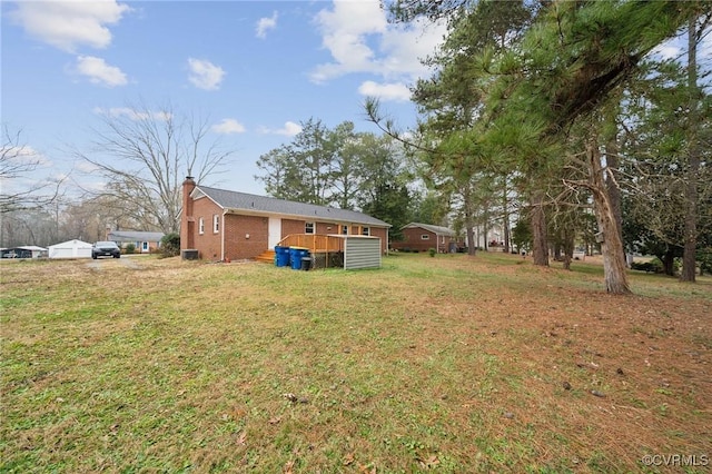 view of yard with a wooden deck