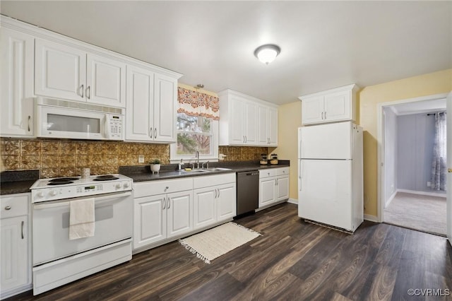 kitchen featuring sink, dark wood-type flooring, tasteful backsplash, white appliances, and white cabinets