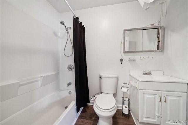 full bathroom with vanity, toilet, wood-type flooring, and shower / tub combo