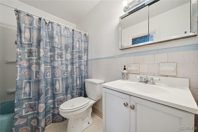 bathroom with vanity, tile patterned flooring, toilet, tile walls, and walk in shower