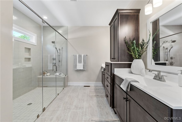 bathroom featuring vanity and walk in shower