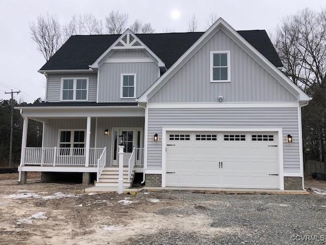 view of front of home featuring a garage and covered porch