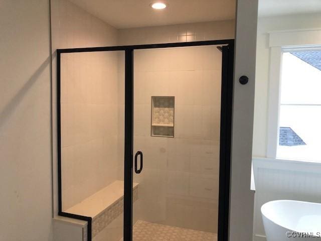 bathroom with independent shower and bath