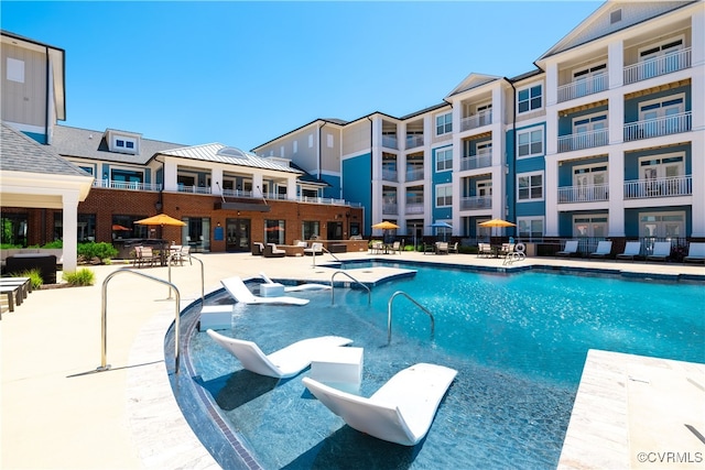 view of pool featuring a patio area