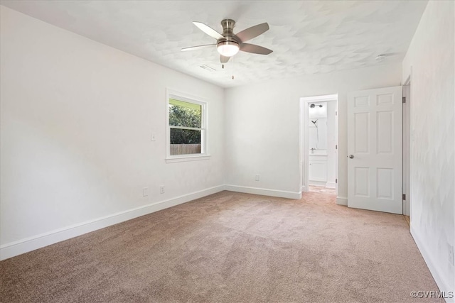 carpeted empty room with ceiling fan