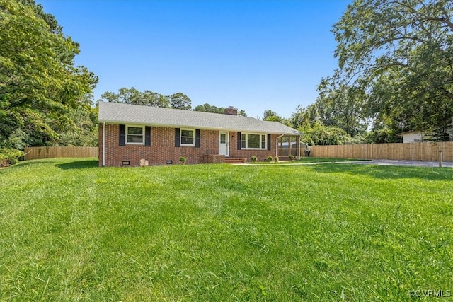 ranch-style house featuring a front lawn