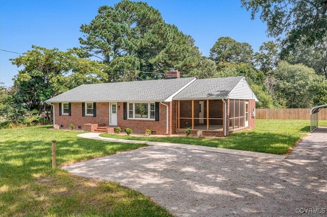 single story home featuring a front yard and a sunroom