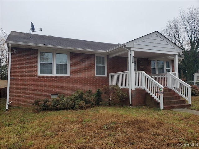 view of front of home featuring a porch and a front lawn