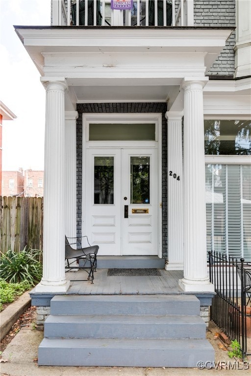 doorway to property featuring french doors and a porch