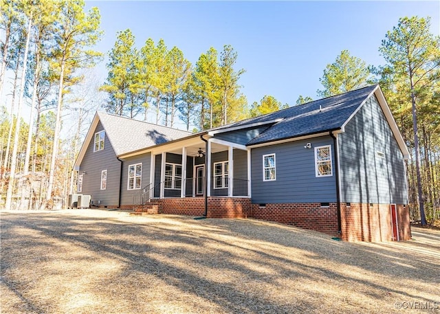 single story home featuring central AC, ceiling fan, and a porch