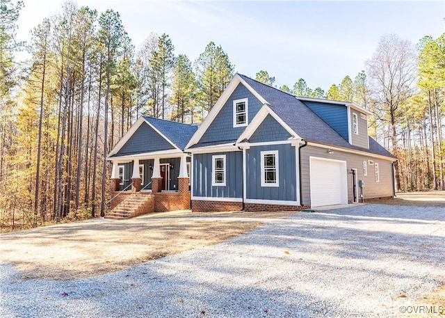 craftsman inspired home with a porch and a garage