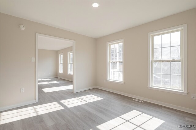 unfurnished room featuring light wood-type flooring