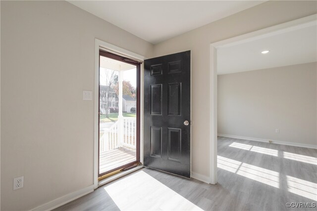 foyer with light hardwood / wood-style flooring