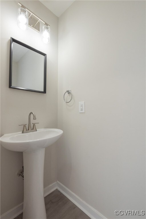 bathroom featuring sink and hardwood / wood-style flooring