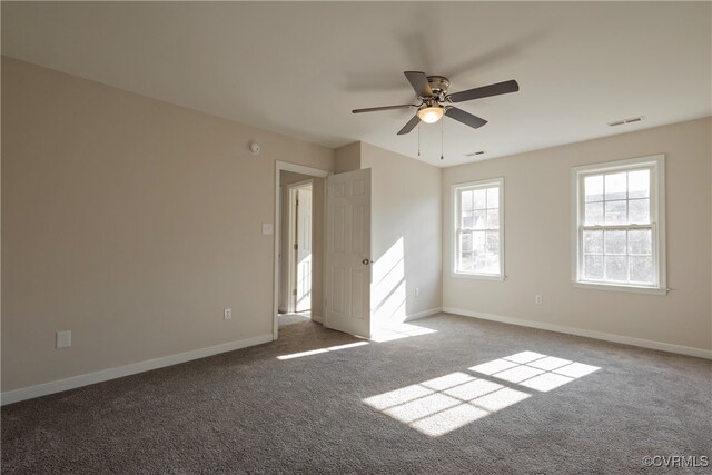 unfurnished room with carpet and ceiling fan