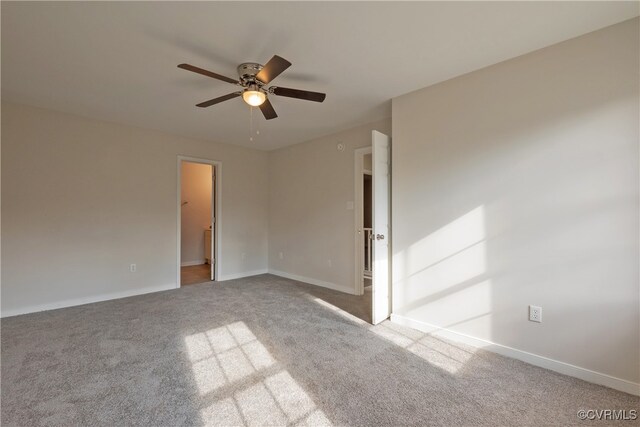 unfurnished room featuring ceiling fan and light colored carpet