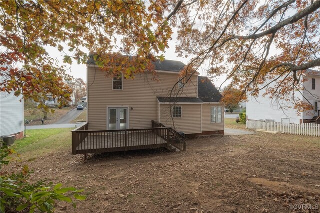 back of house featuring a deck