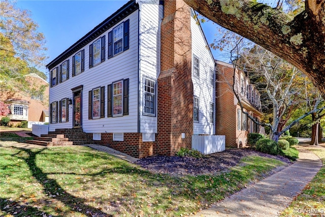 view of home's exterior featuring a lawn