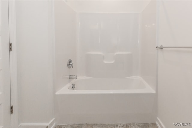 bathroom featuring tile patterned floors and bathtub / shower combination